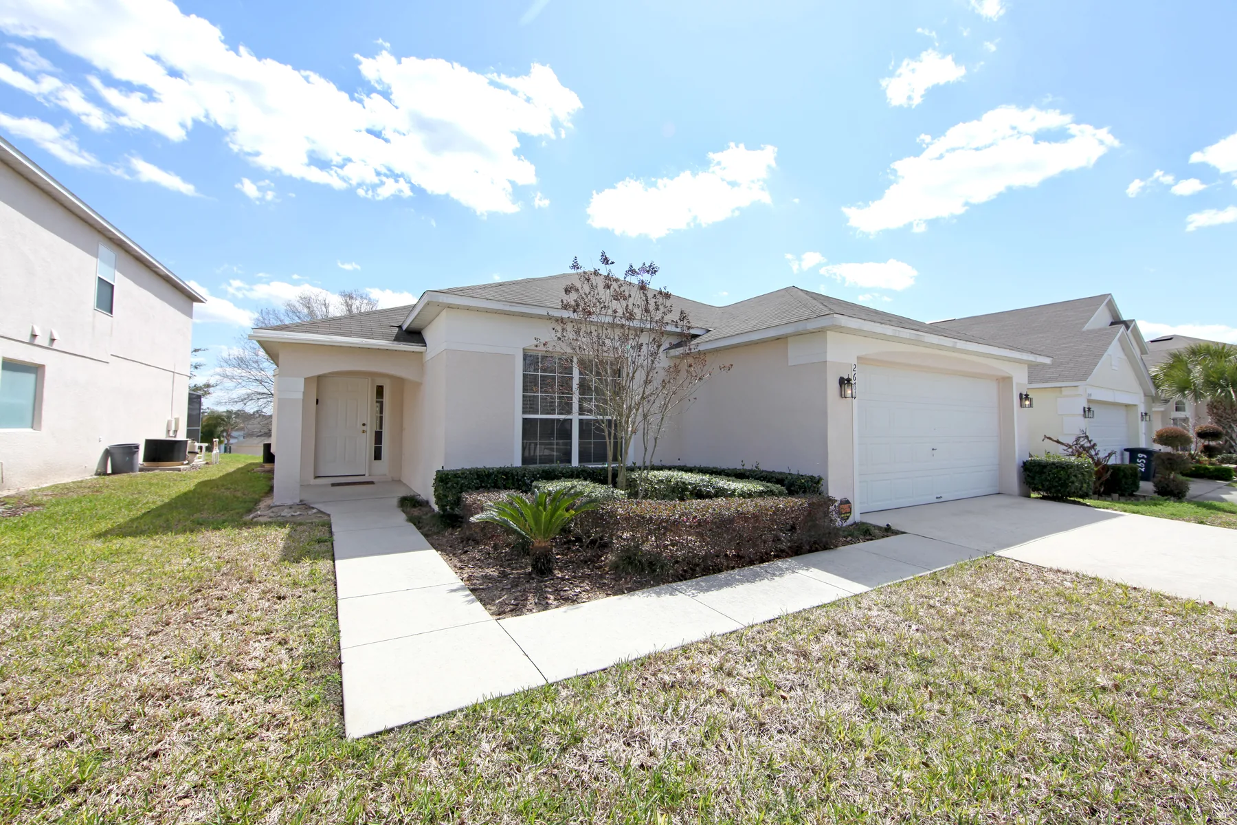 Single-story home with driveway and front lawn